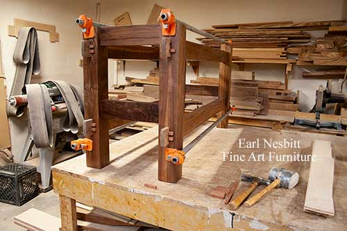 classic dining table base in Earl's shop showing pegged through tenon joinery